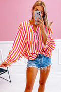 Blusa de manga abullonada con escote en V y botones delanteros, de rayas naranjas.