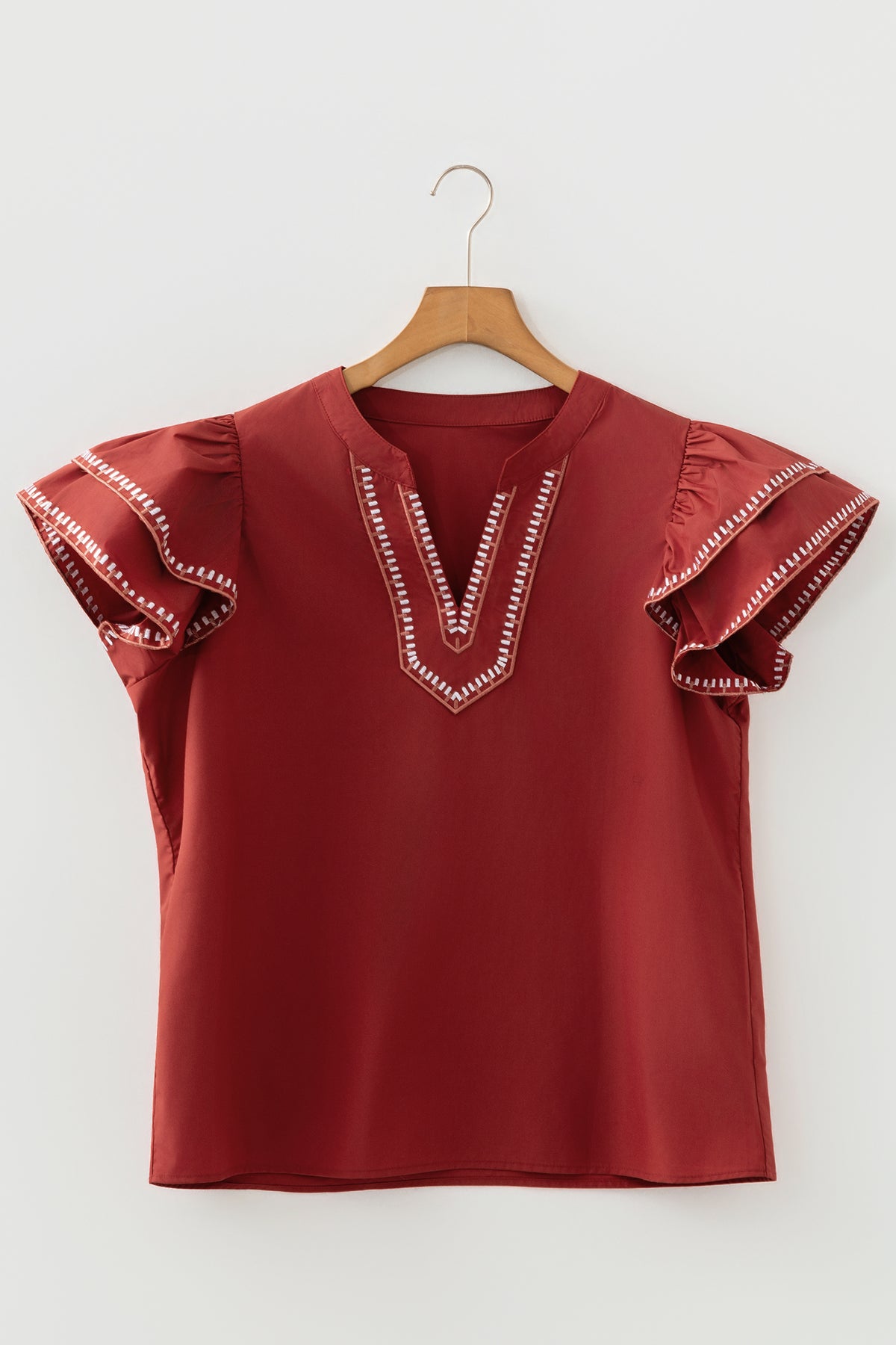 Blusa de cuello en V con mangas acampanadas y ribete de contraste color arcilla