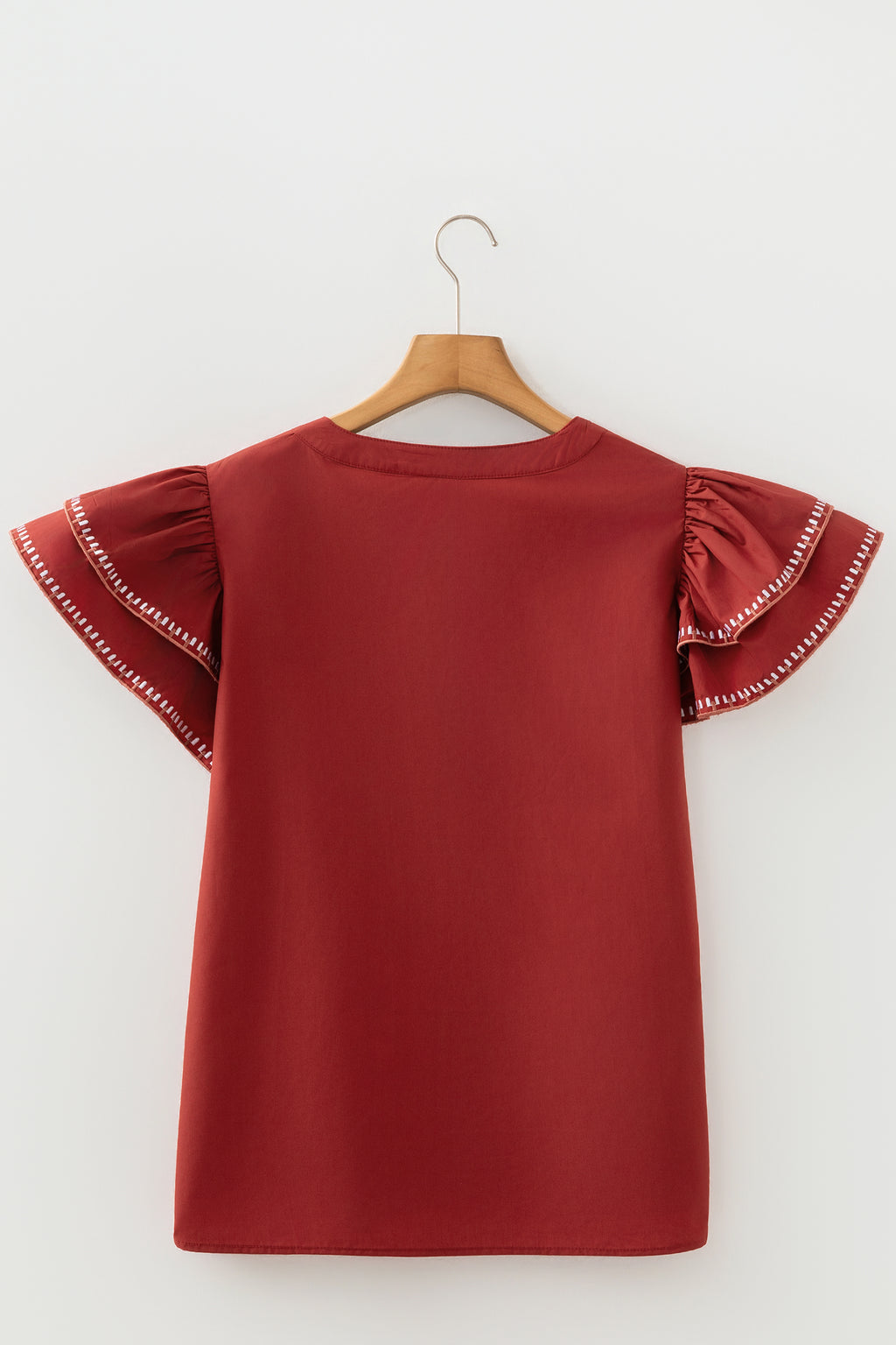 Blusa de cuello en V con mangas acampanadas y ribete de contraste color arcilla