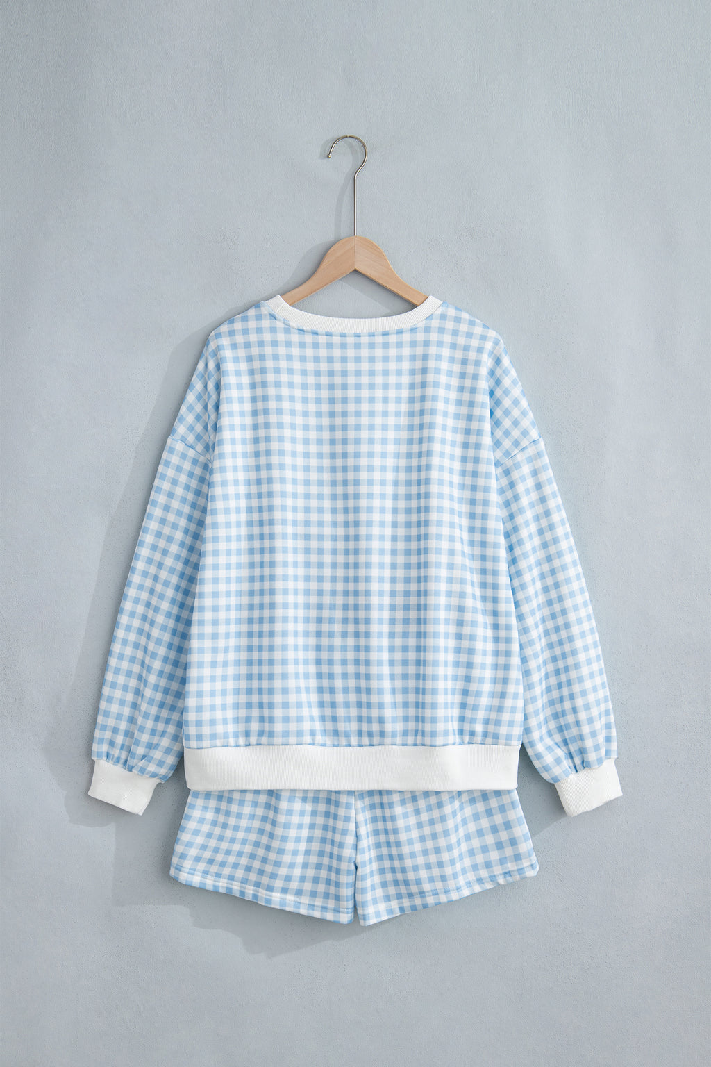 Conjunto de 2 piezas: jersey holgado de cuadros azul cielo con cordón ajustable y shorts casuales.