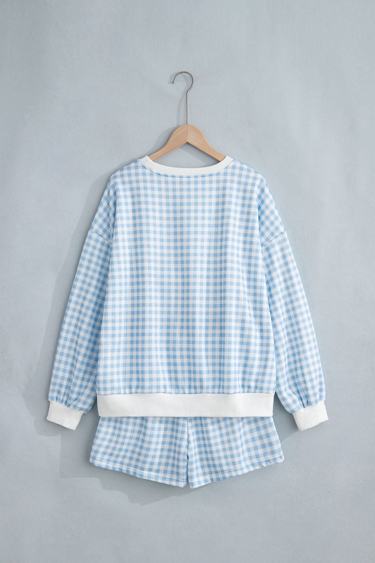 Conjunto de 2 piezas: jersey holgado de cuadros azul cielo con cordón ajustable y shorts casuales.